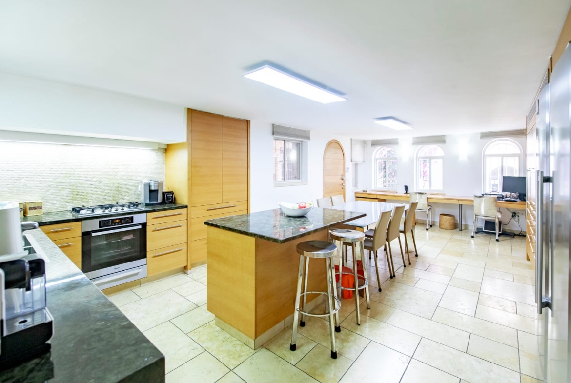 Modern Wood and Marble Kitchen With Full-Sized Dining Table